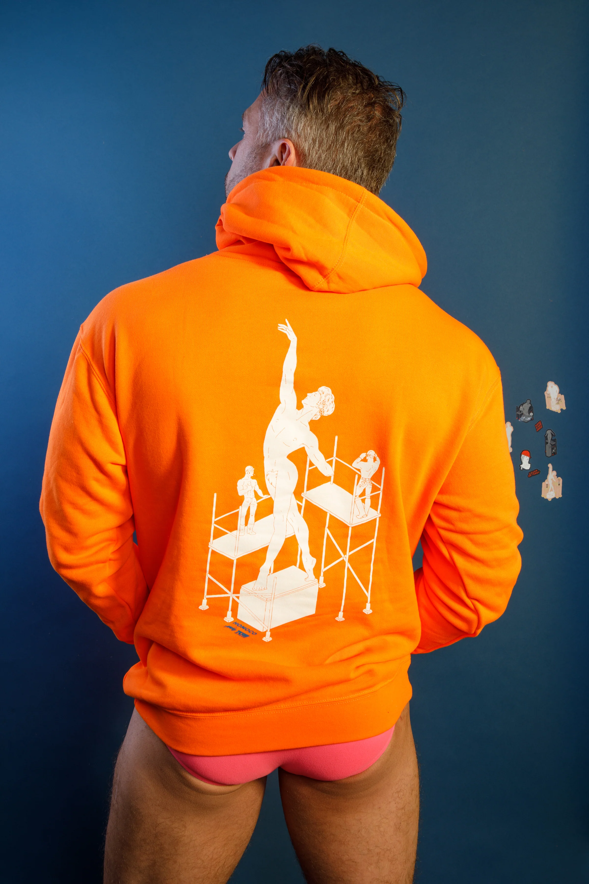 Tom of Finland Safety Orange Lover of Many Hoodie By HOMOCO - Image 11