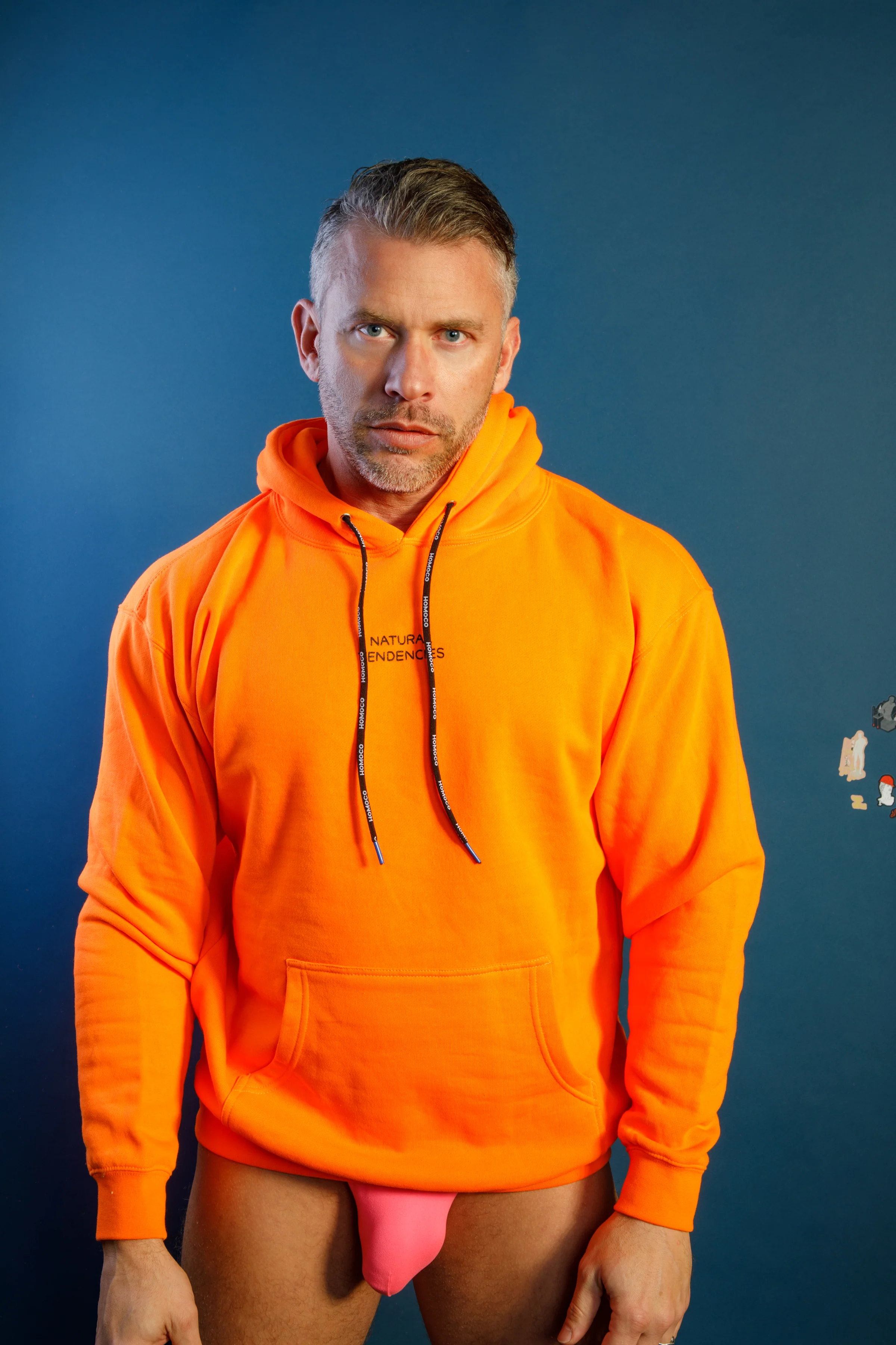 Tom of Finland Safety Orange Lover of Many Hoodie By HOMOCO - Image 7